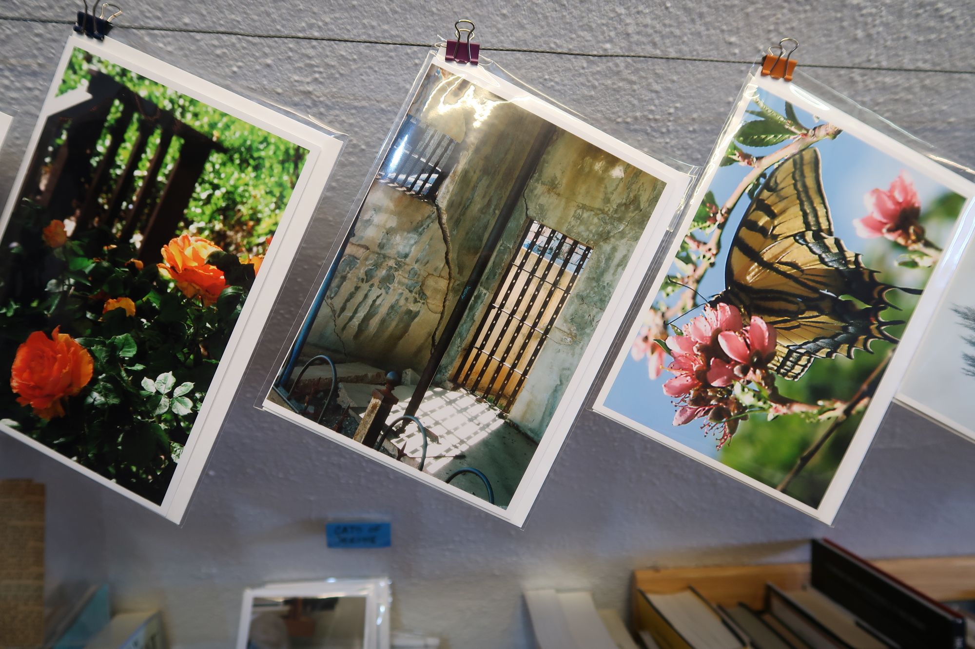 Photo of photos at Kate's Books showing the Sliding Jail at Jerome.