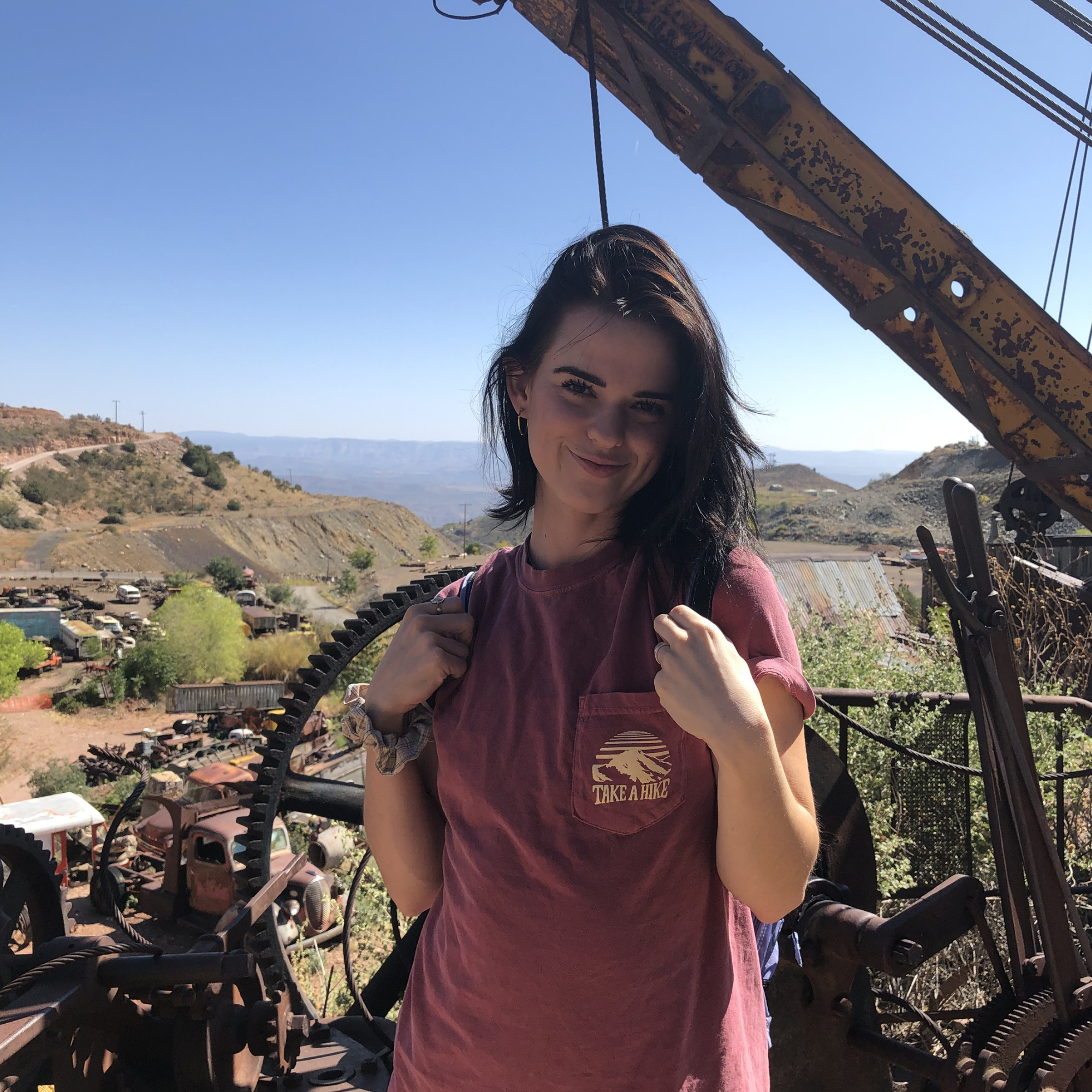 Girl standing on hill overlooking Verde and Jerome