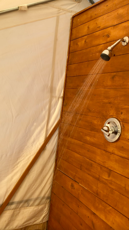 shower inside the bathroom tent