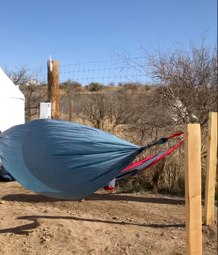 two hammocks flying in the wind before we glamp