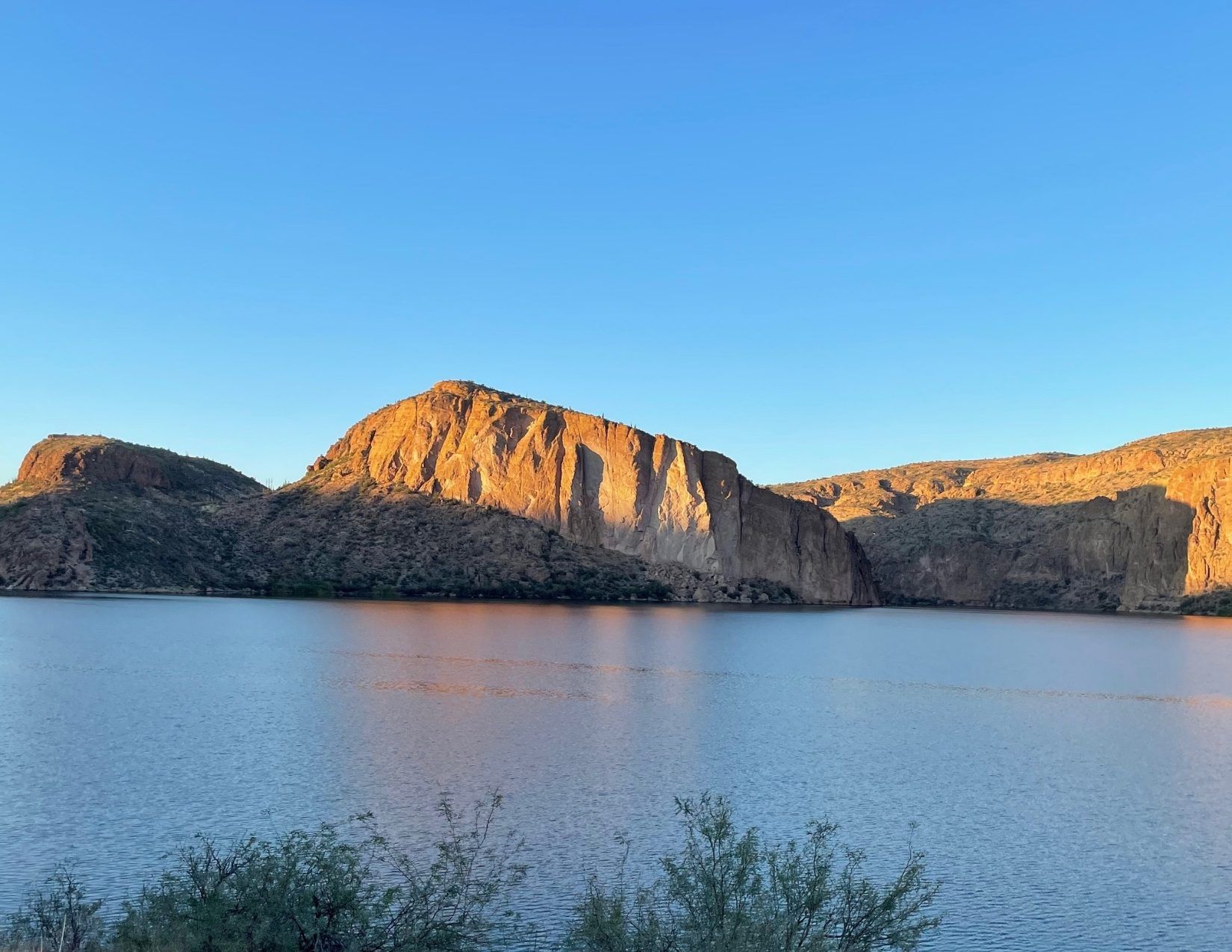 blue sky, sun reflecting off of the rocks, a blue lake, the Apache Trail, Mesa, Arizona