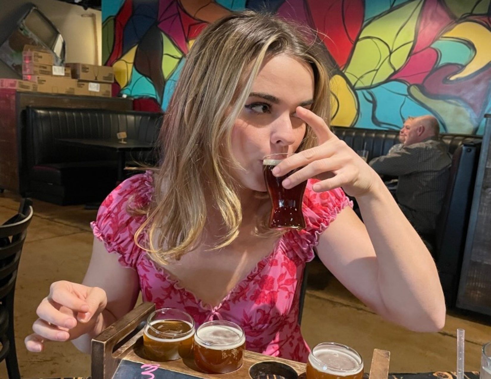 young girl takes sip of beer at Old Ellsworth Brewing Company in Mesa Arizona on the Fresh Foodie Trail