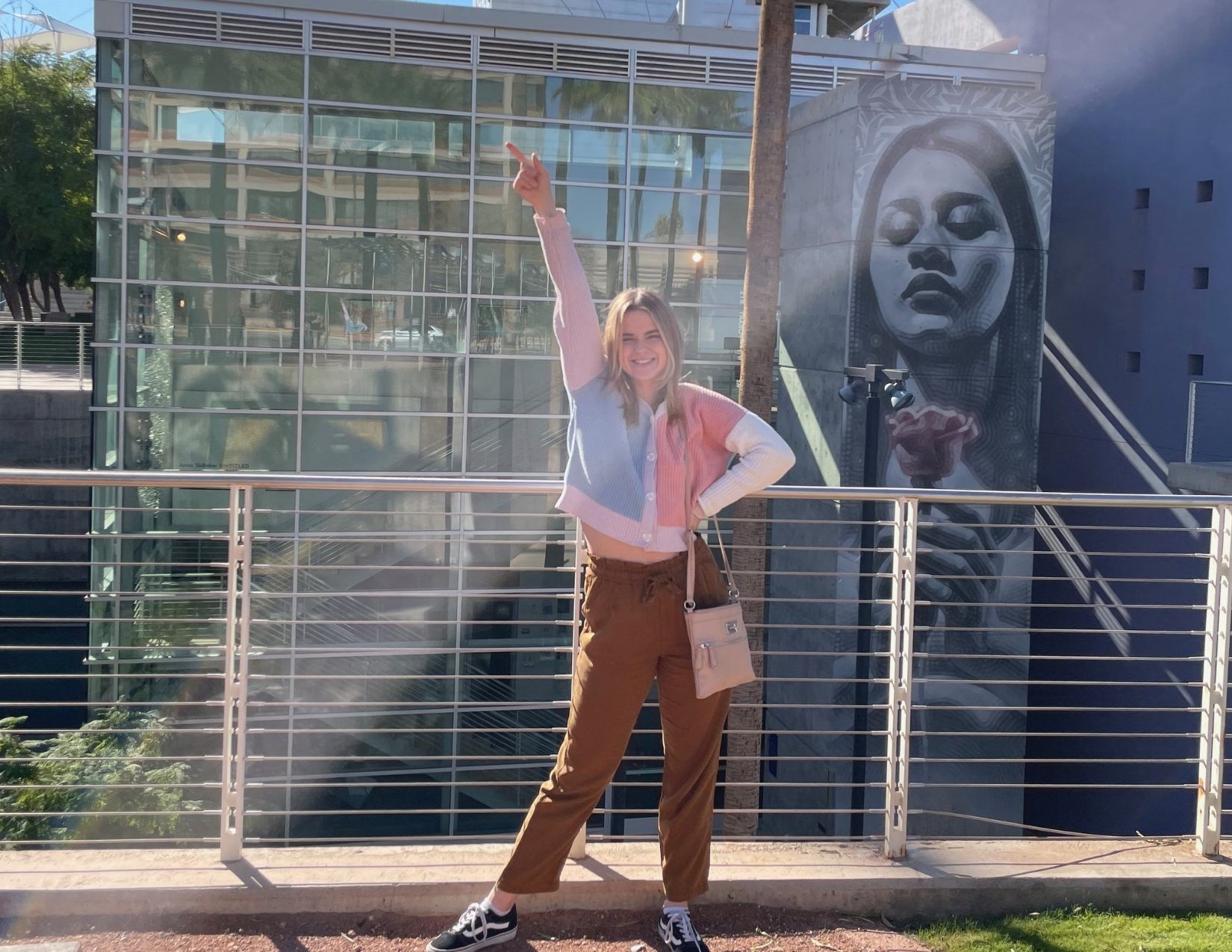 a girl posing in front of the Mesa Arts Center in Mesa, Arizona