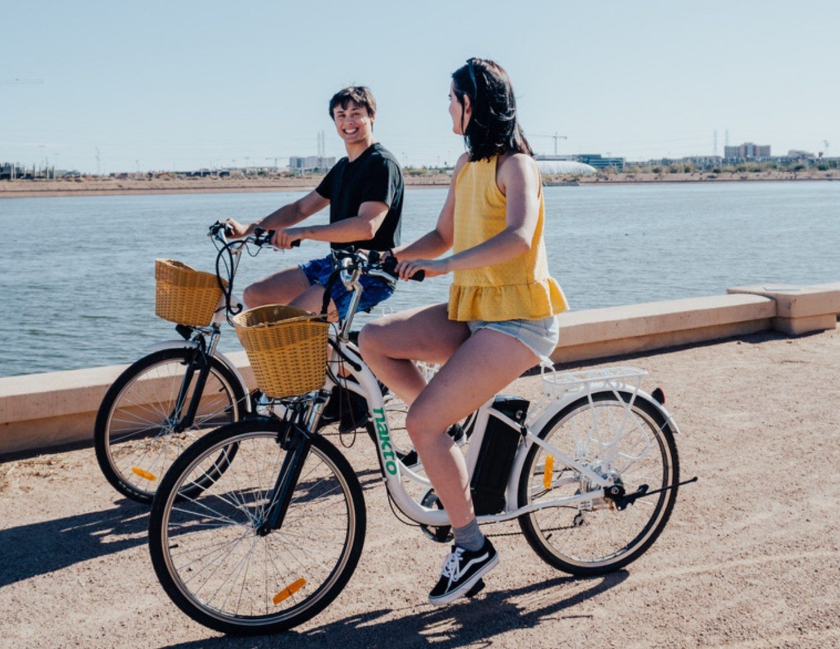 Ian and Lacy Cain riding bikes along Tempe Town Lake in Tempe Arizona