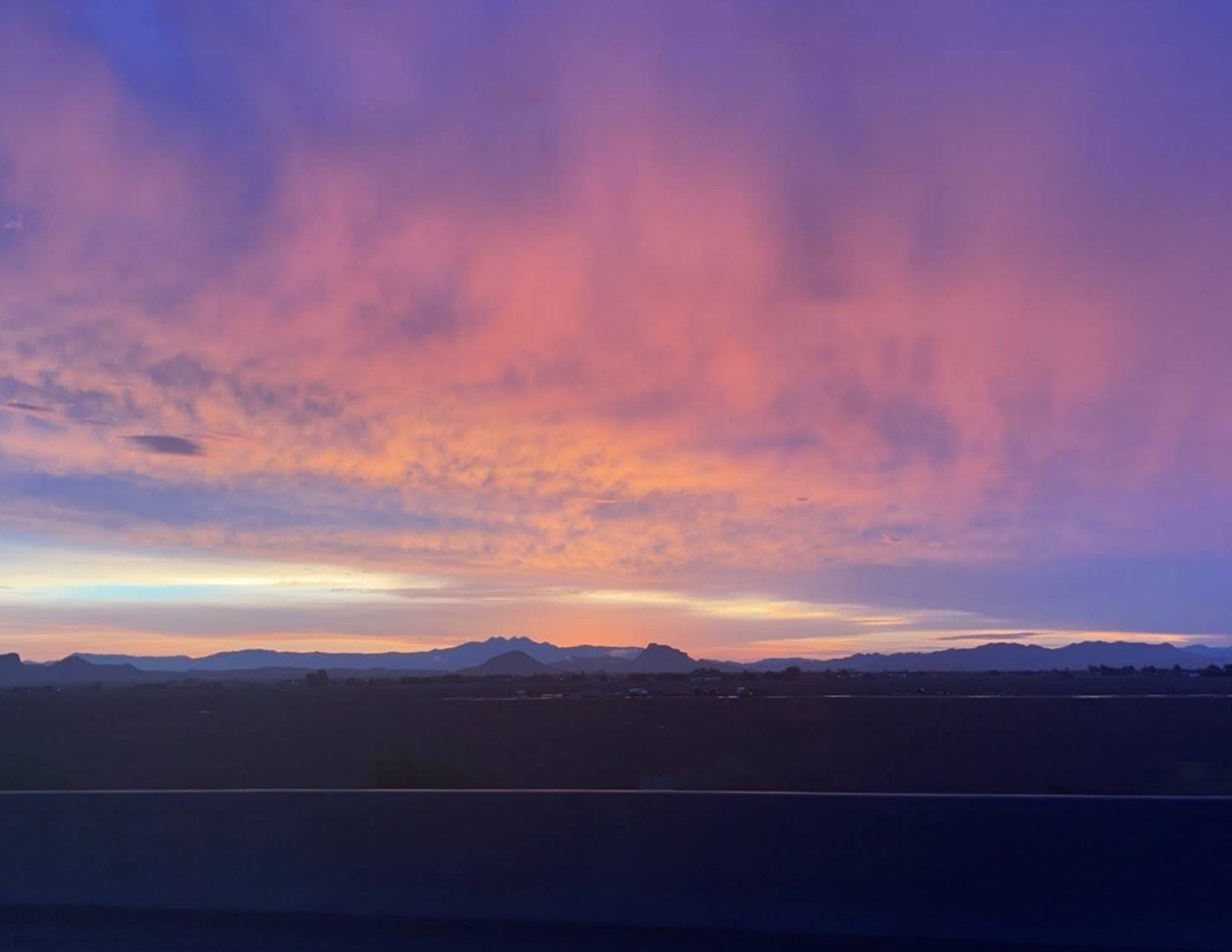 orange, pruple, blue, and pink sunrise along the highway in Payson Arizona