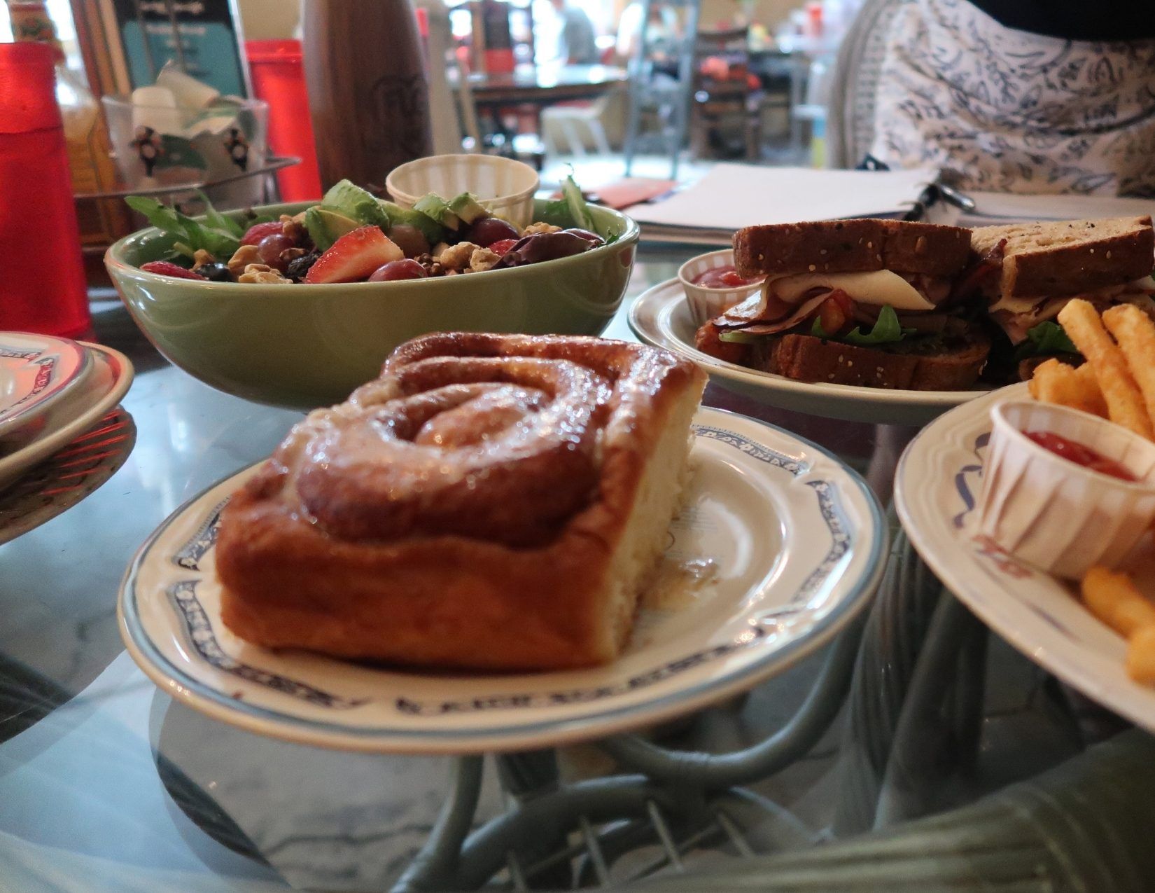 giant cinnamon roll, salad, sandwich, french fries, all for brunch