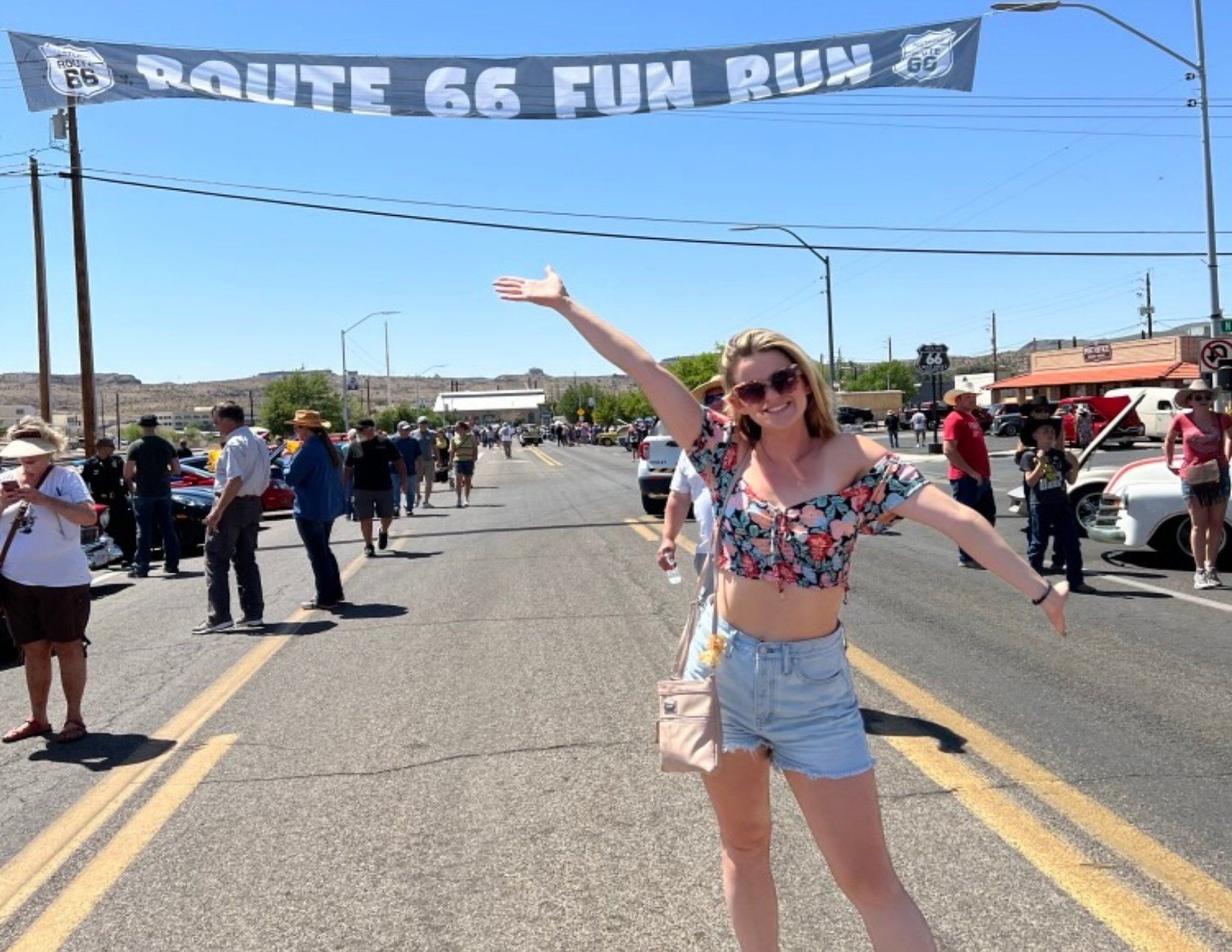 Young Girl Standing Under Route 66 Fun Run Banner in Kingaman Arizona