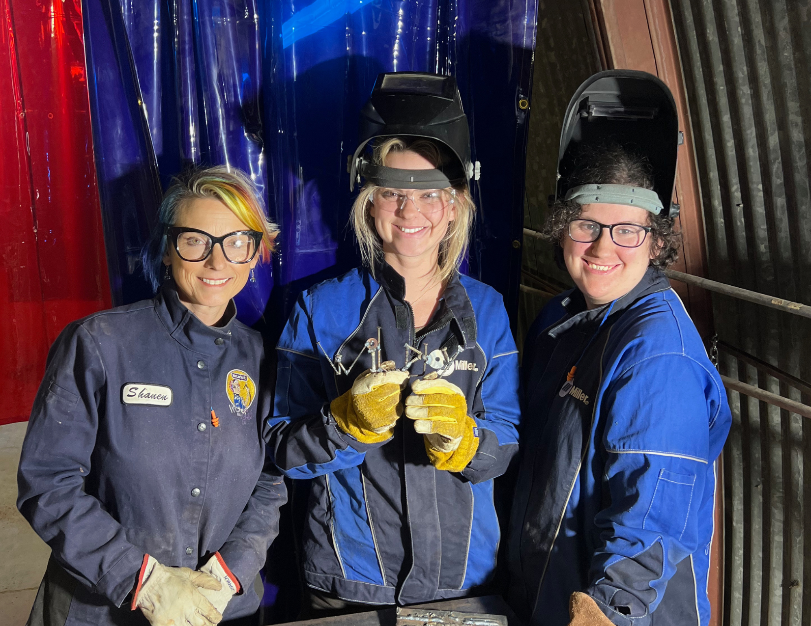 Lacy Cain Baranack and two female welders showing off their skills in welding