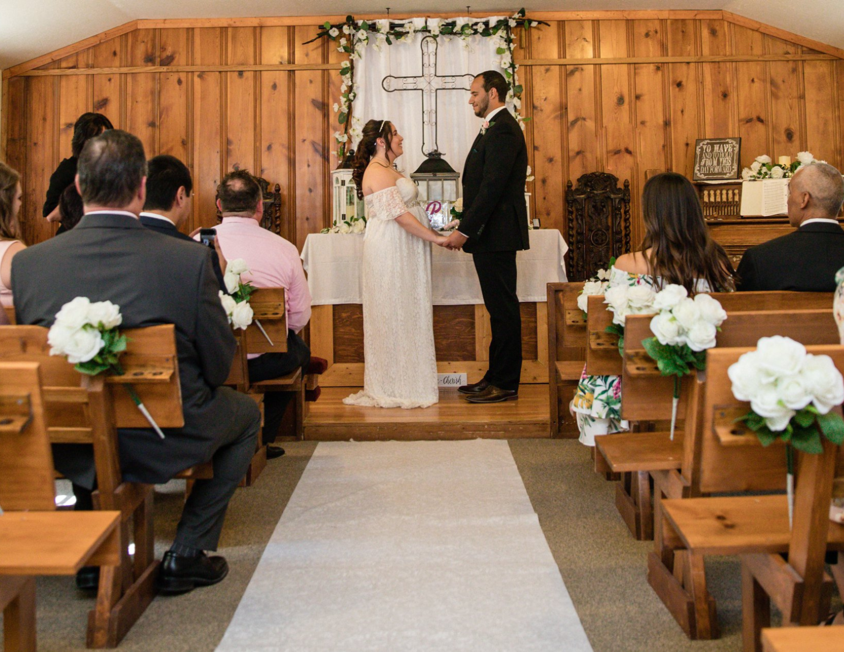 An elopement wedding with the newly wed couple saying their vows in a small wedding chapel in Cave Creek, Arizona