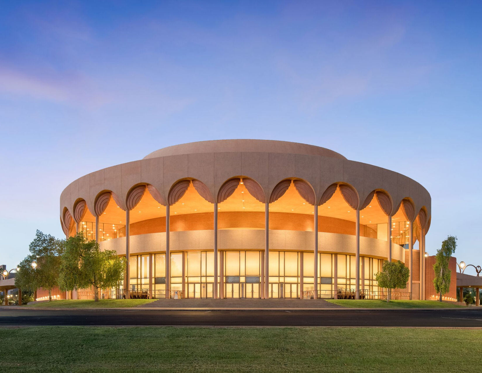 The outside Gammage Auditorium lit up during sunset as a Broadway show is performed inside the theater.