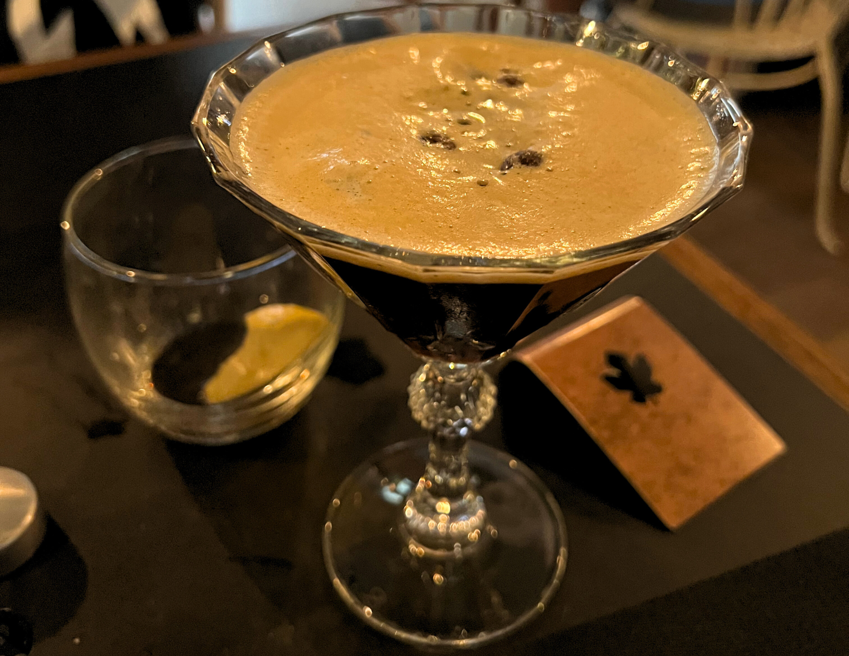 An espresso martini in a beautiful glass from a restaurant in Florence, Italy