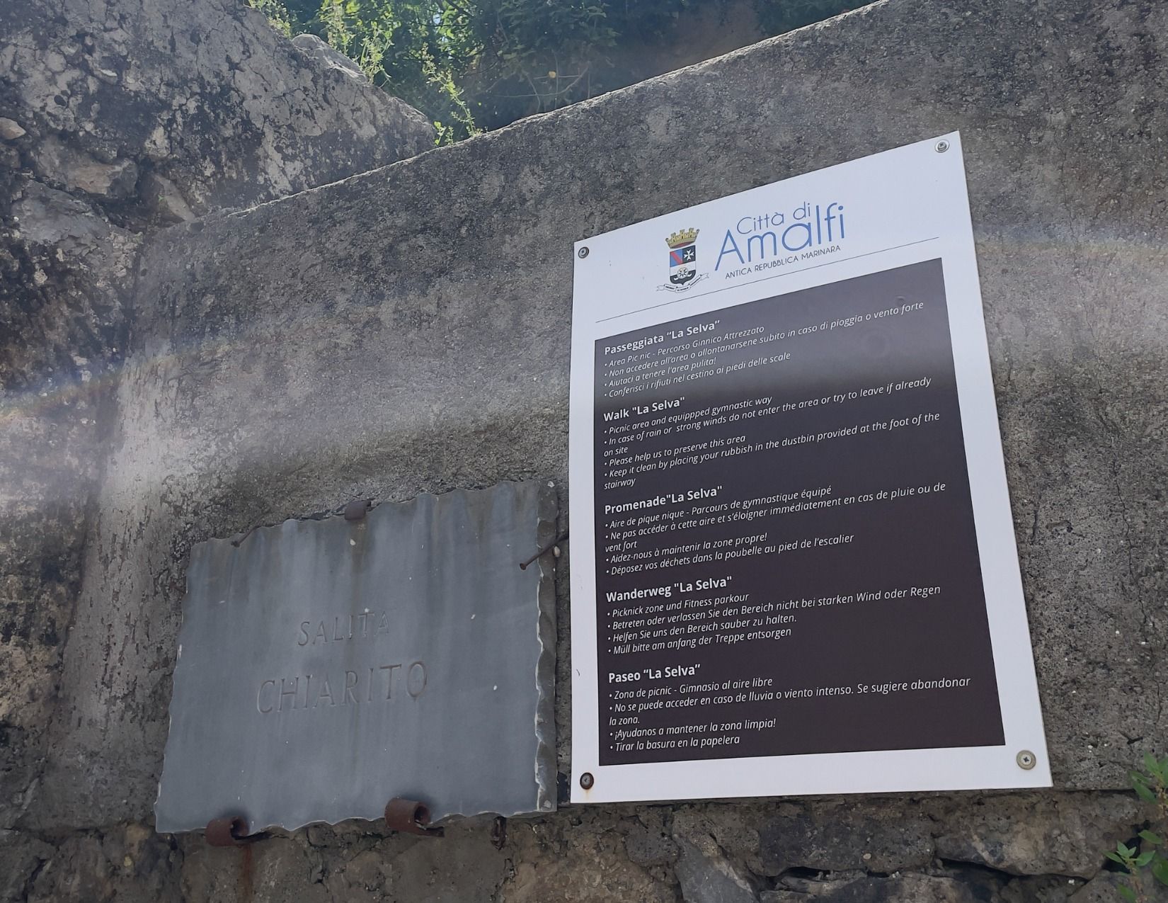 Sign posted on rock wall for the "La Selva" walk in Amalfi, Italy