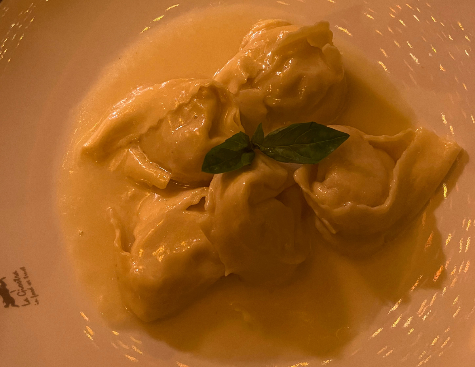 Plate of pear ravioli garnished with basil at La Giostra in Florence, Italy