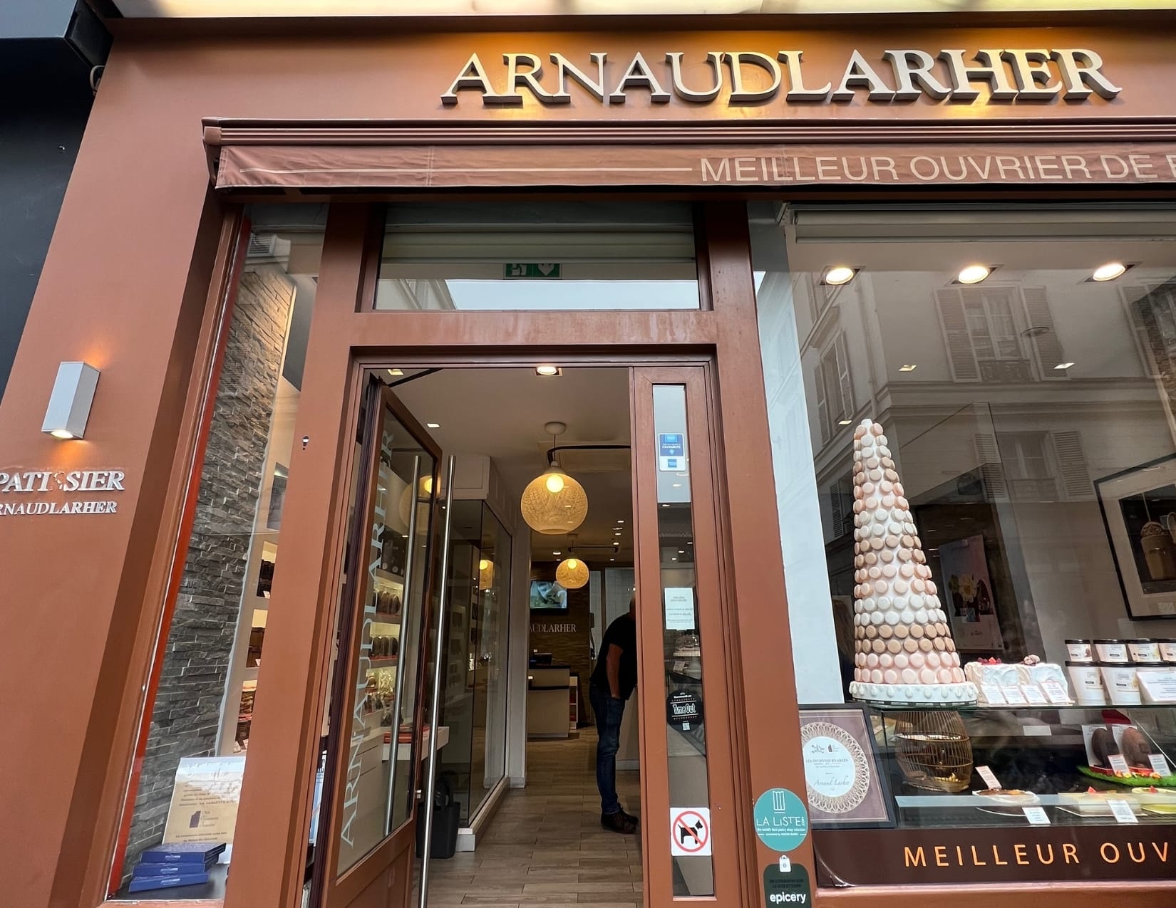 Tower of macarons in the window at Arnaud Larher in Paris, France