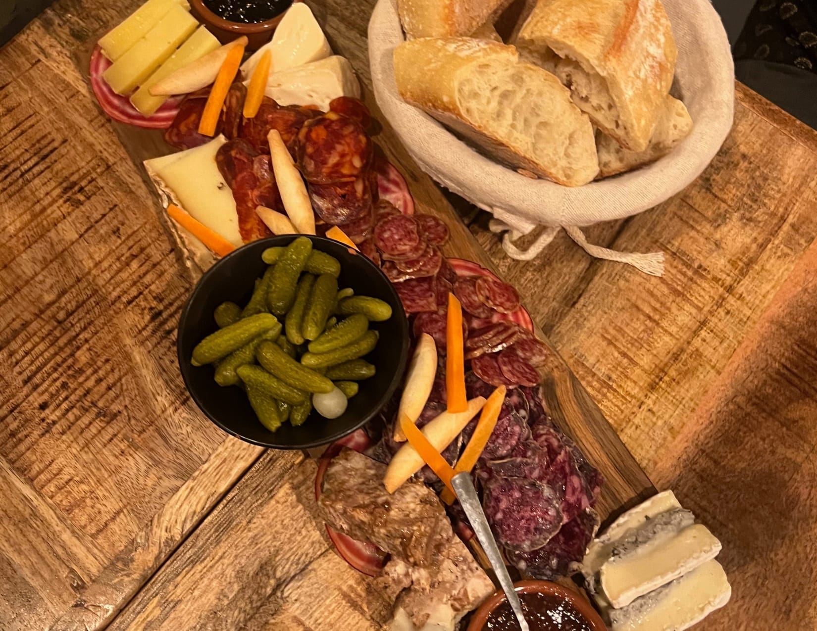 Charcuterie board with salami, chorizo, cheese and vegetables at Le 17.45 in Paris, France