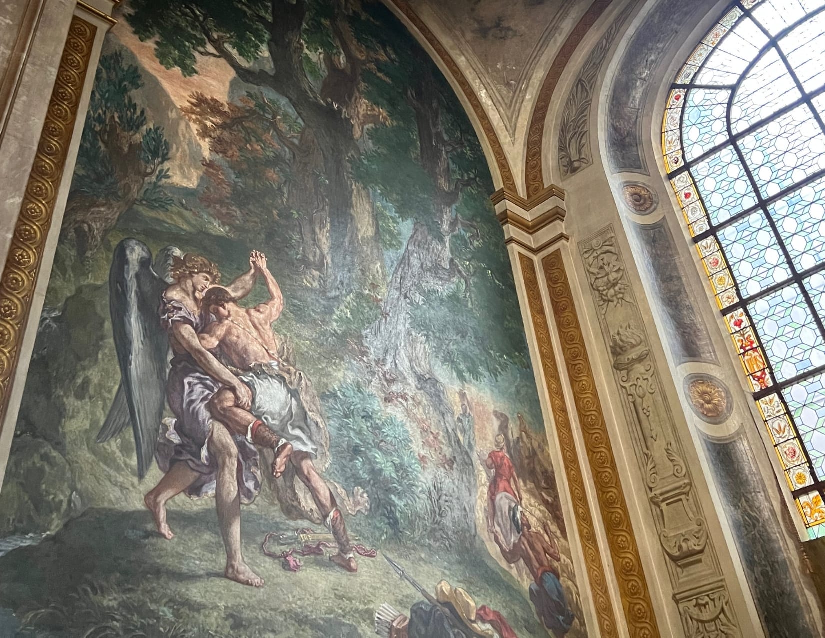 Beautiful painting and architecture inside of the Église Saint-Sulpice in Paris, France