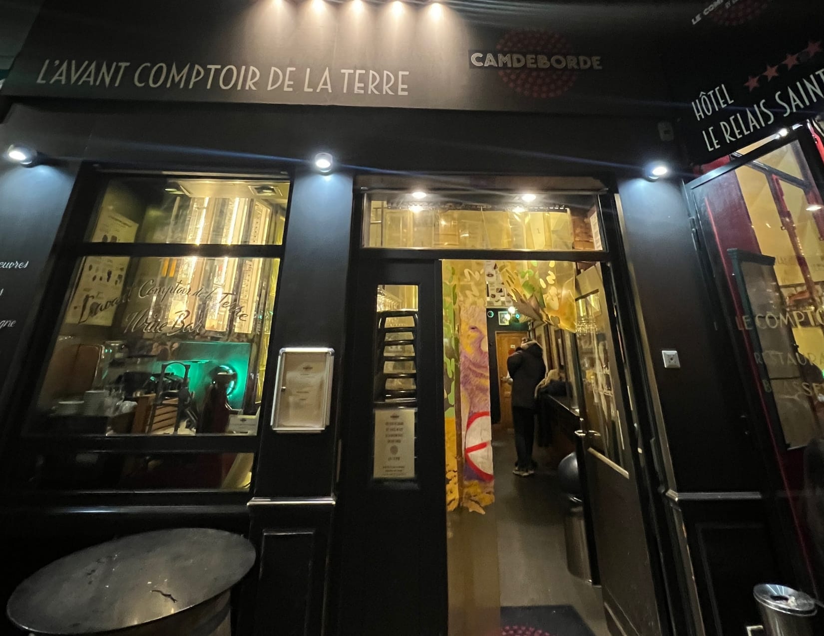 Outside of L'avant Comptoir de la Terre wine bar in Paris, France