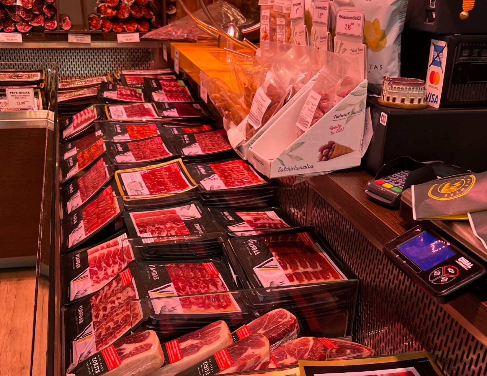 deli meats presented in a cooler at Viandas de Salamanca in Paris, France