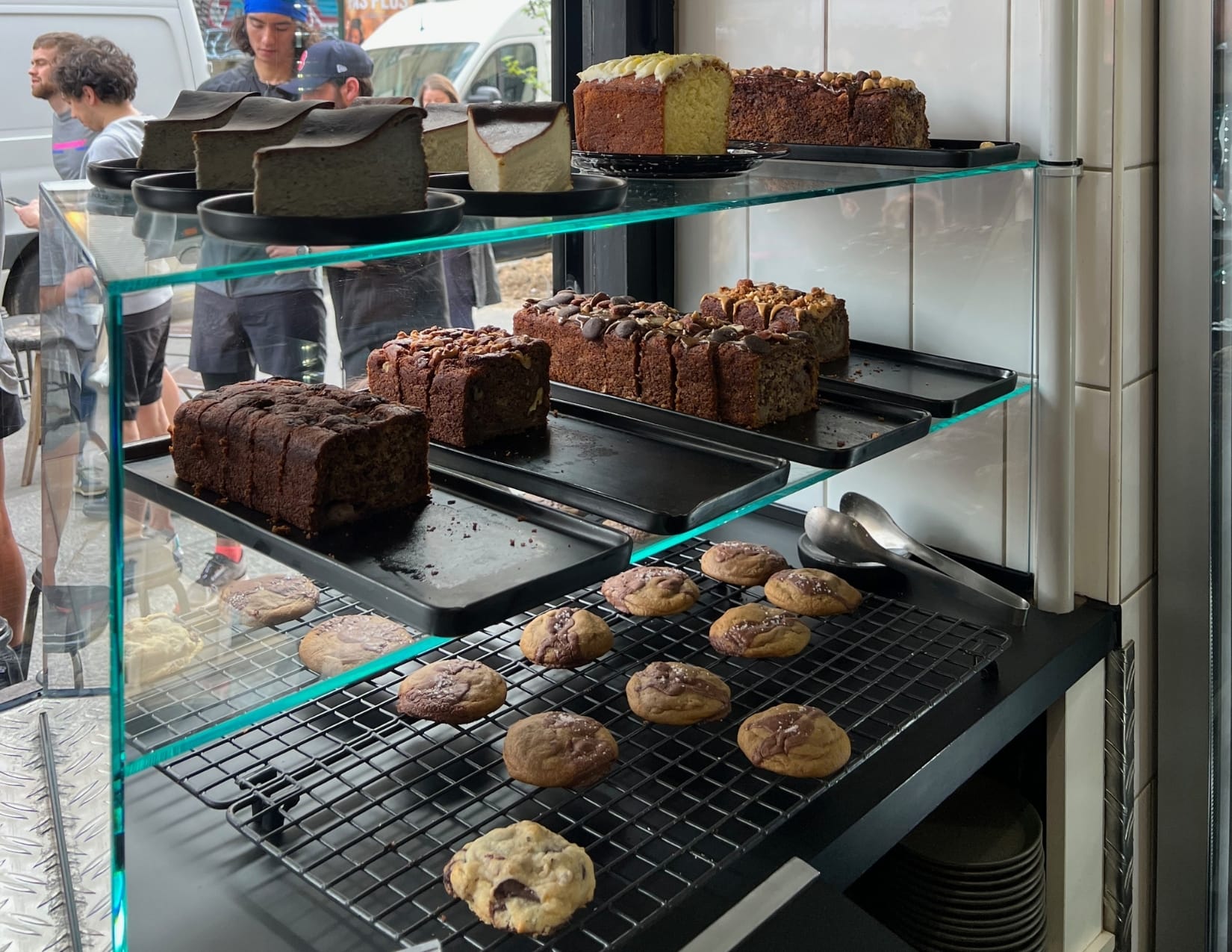 Glass container with cookies, breads and cakes at Motors Coffee in Paris, France