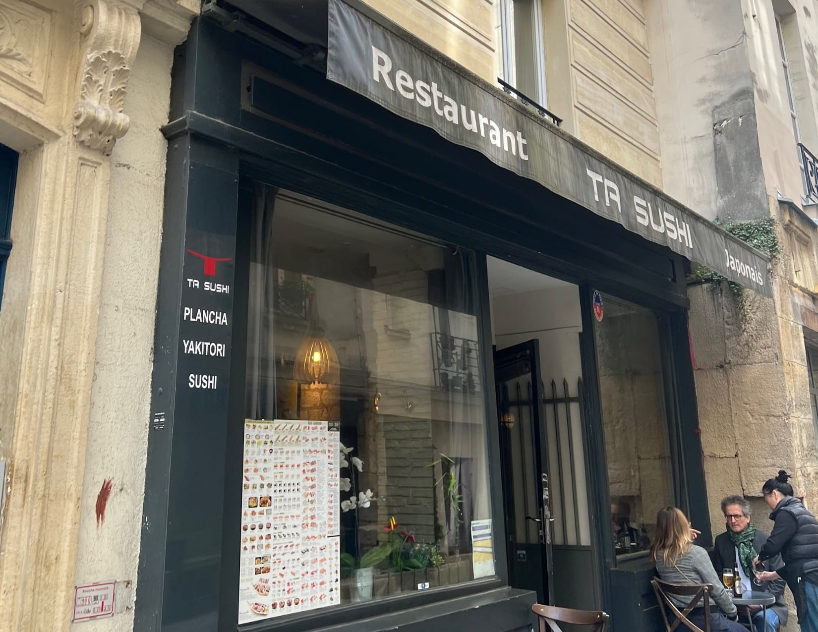 Outside of Ta Sushi restaurant in Paris, France